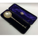 A cased silver presentation spoon with twisted ste