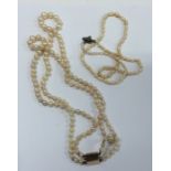 A graduated double string of pearl beads with conc