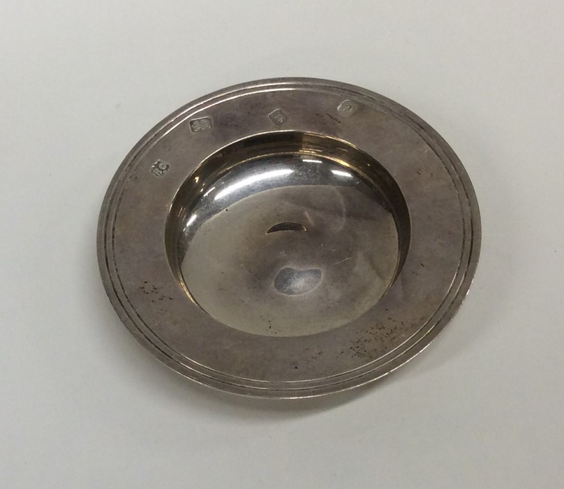 A circular silver armada dish. London. By RC. Appr