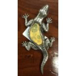 A novelty silver brooch in the form of a lizard. A