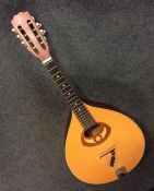 An Ozark flat back mandolin. Est. £50 - £80.