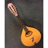 An Ozark flat back mandolin. Est. £50 - £80.