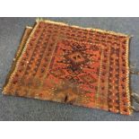 An old Persian rug in blue ground. Est. £20 - £30.