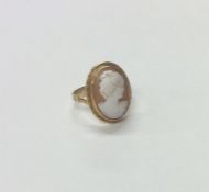 A 9 carat framed cameo ring. Approx. 4 grams. Est.