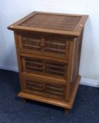 A reproduction hardwood bedside cabinet. Est. £15
