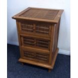 A reproduction hardwood bedside cabinet. Est. £15