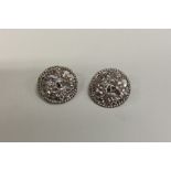 Two Edwardian silver cast buttons decorated with f