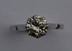 A good diamond single stone mounted as a ring in e