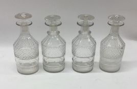 A set of four Antique glass decanters with lift-ou