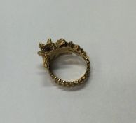 A stylish gold ring in the form of a seahorse with