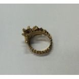 A stylish gold ring in the form of a seahorse with