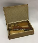 A selection of silver mounted combs, brushes etc.