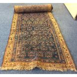 A long Eastern tapestry runner in blue ground. Est