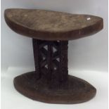 A carved tribal double sided stool. Est. £20 - £30