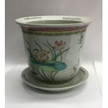 A 20th Century pottery fish bowl on stand decorate
