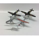 A group of Corgi Military toy aircraft on stands.