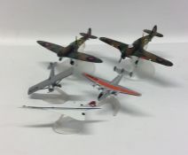 A group of Corgi Military toy aircraft on stands.