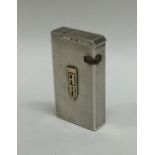 An unusual Dunhill engine turned silver lighter. A
