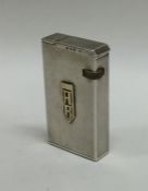 An unusual Dunhill engine turned silver lighter. A