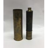 An old brass shell case together with an old brass