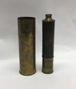 An old brass shell case together with an old brass