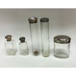 A group of cut glass and silver mounted dressing t