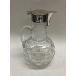 An Edwardian silver hinged top lemonade jug with p