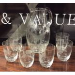 An attractively etched lemonade set decorated with