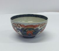 An early Chinese decorated tea bowl with flower mo