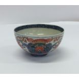 An early Chinese decorated tea bowl with flower mo