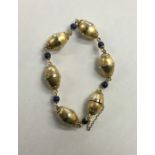 A French 18 carat gold lapis bracelet with conceal