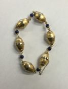 A French 18 carat gold lapis bracelet with conceal