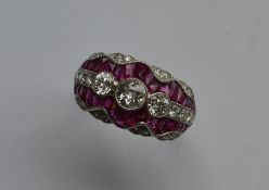 A stylish ruby and diamond cocktail ring with scro