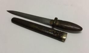 A Japanese brass mounted knife together with a she