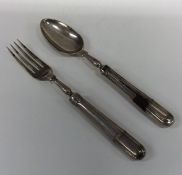 A Victorian silver travelling spoon and fork with