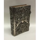 A good quality embossed silver Holy Bible dated 18