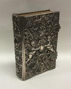 A good quality embossed silver Holy Bible dated 18