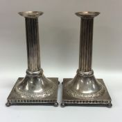 A pair of Continental cast silver candlesticks wit