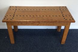 A good quality oak table with parquetry decoration