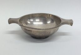 A modern silver two handled quaich on pedestal foo