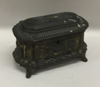 A Continental dome top spelter casket with fitted