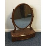 A Georgian mahogany bow fronted toilet mirror. Est