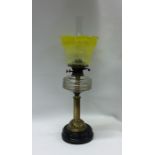 An attractive brass mounted oil lamp with etched y