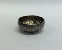 A small Russian silver gilt bowl with weave work d