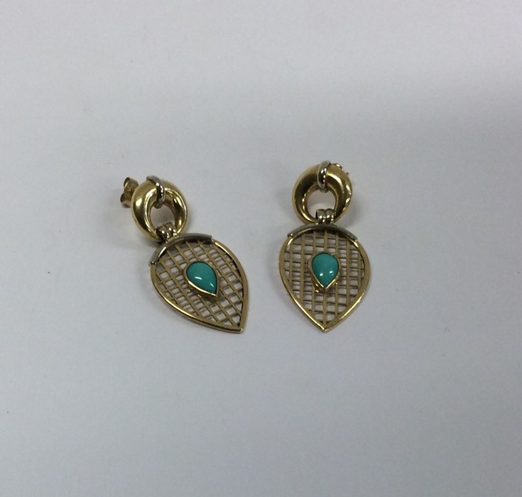 A pair of 18 carat turquoise mounted earrings. App