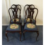 A set of four Victorian mahogany chairs with slip-