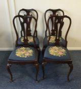 A set of four Victorian mahogany chairs with slip-