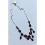 An attractive cabochon garnet and gold mounted fri