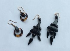 A pair of large jet drop earrings together with a