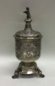 An unusual Continental silver cup and cover mounte